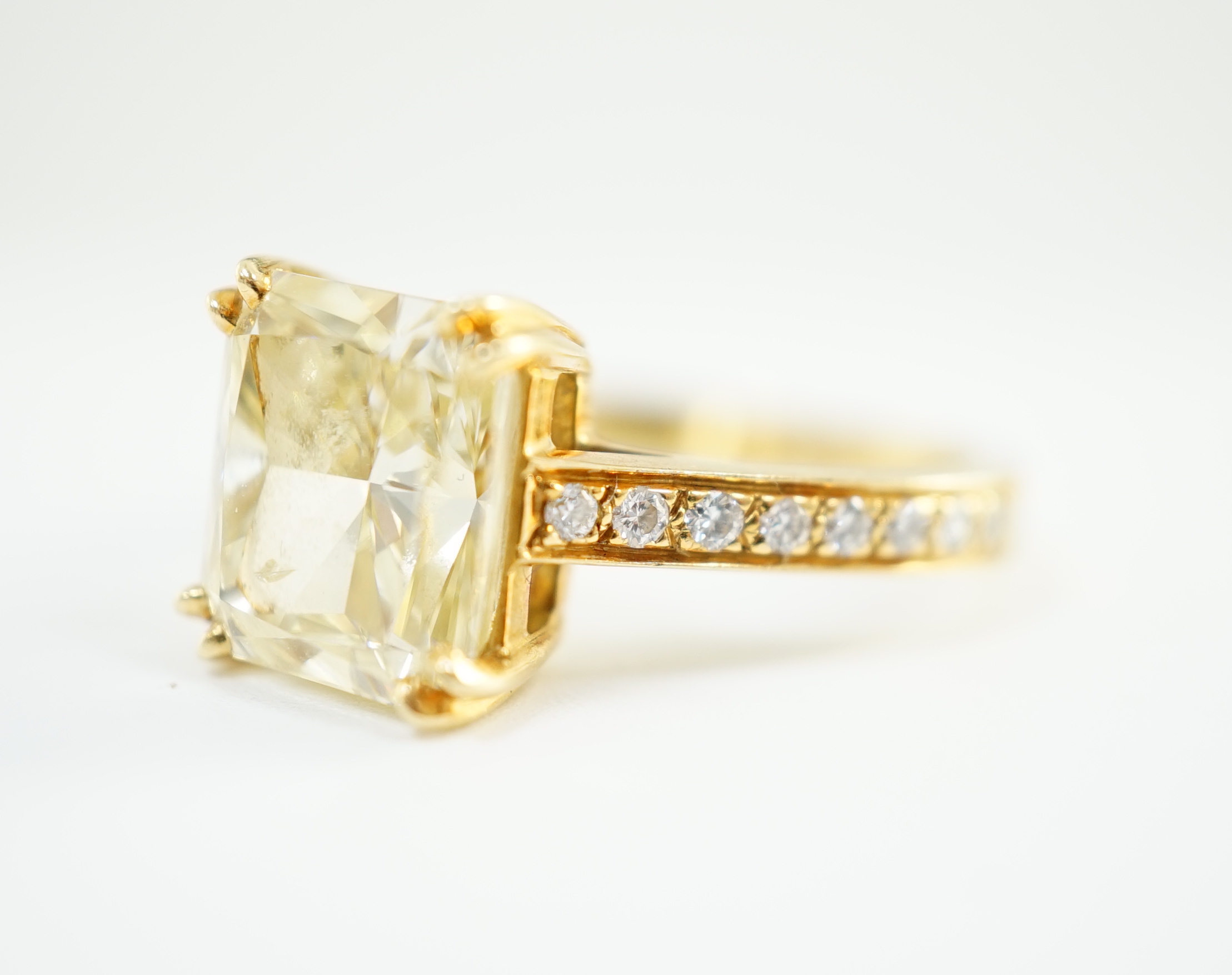 An impressive modern 18ct gold and cut cornered rectangular modified brilliant cut natural fancy yellow single stone diamond ring